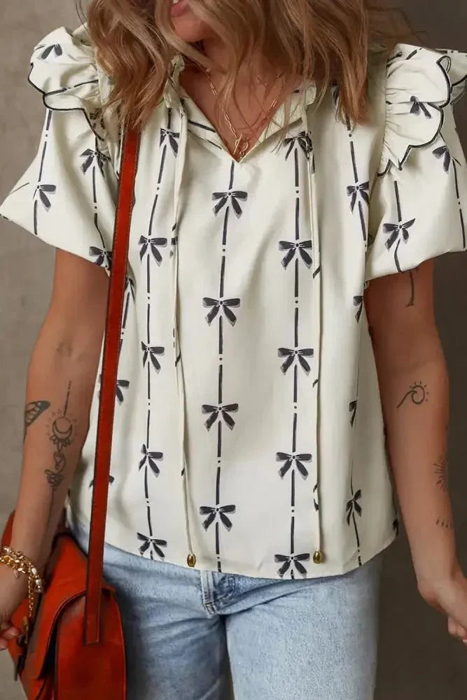 Bow Print Tie Neck Short Sleeve Blouse - Update AvenueVacation StyleTrendsi100100733236571100100733236571d8dae919 - e400 - 429d - bbc8 - b397747e61b3 - MaxIvory
