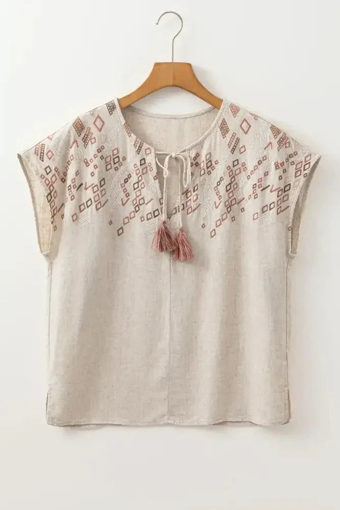 Geometric Embroidered Short Sleeve Tassel Tie Neck Blouse - Update AvenueBoho VibesTrendsi1001004602085971001004602085973f6b1c36 - 84d6 - 4488 - a98f - 483f6f34fc59 - Max - OriginBeige