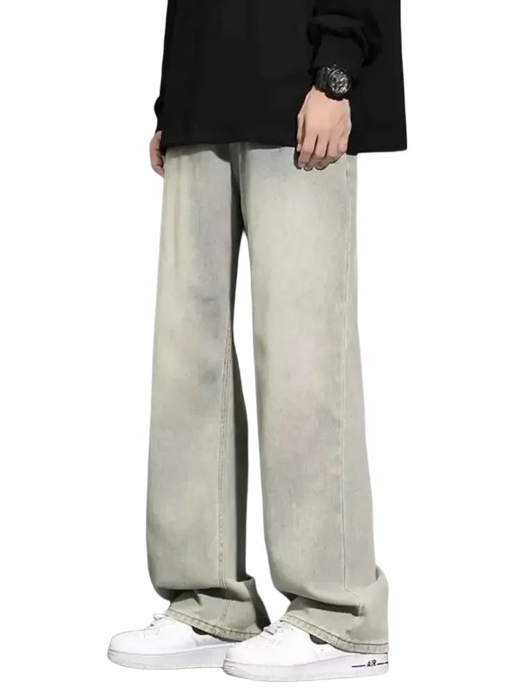 Men’s full size wide leg jeans in light wash with white sneakers, size wide fit