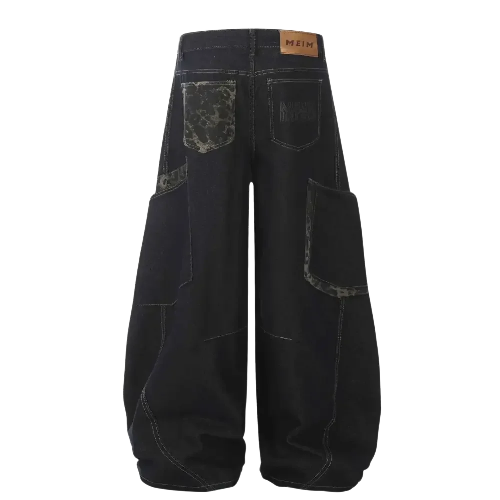 Black denim wide leg cargo jeans with patterned pockets and a brown brand patch
