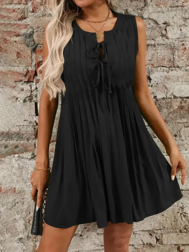 Tied Front Pleated Sleeveless Mini Dress - Update AvenueEffortless Elegance: DressesTrendsi1001007373995931001007373995937ed5e7ac - 57ca - 4743 - b862 - 3f86ed4e35a3 - MaxBlack