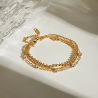 18K Gold - Plated Layered Inlaid Zircon Bracelet - Update AvenueBraceletsTrendsi10050072840108410050072840108418K Gold - Plated Layered Inlaid Zircon BraceletGold