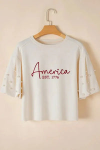 AMERICA EST 1776 Embroidered Pearl Beaded Sleeve T Shirt - Update AvenueT-ShirtsTrendsi100100804468917100100804468917ef0321a0 - 0421 - 4bc9 - 827f - cf36d6bdd0a0 - Max - OriginWhite