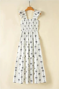Bow Print Smocked Square Neck Ruffle Tiered Maxi Dress - Update AvenueFestival VibesTrendsi100100002018960100100002018960d9d98c18 - 925f - 4daf - 90a9 - b5dc9d6bf1e0 - MaxWhite