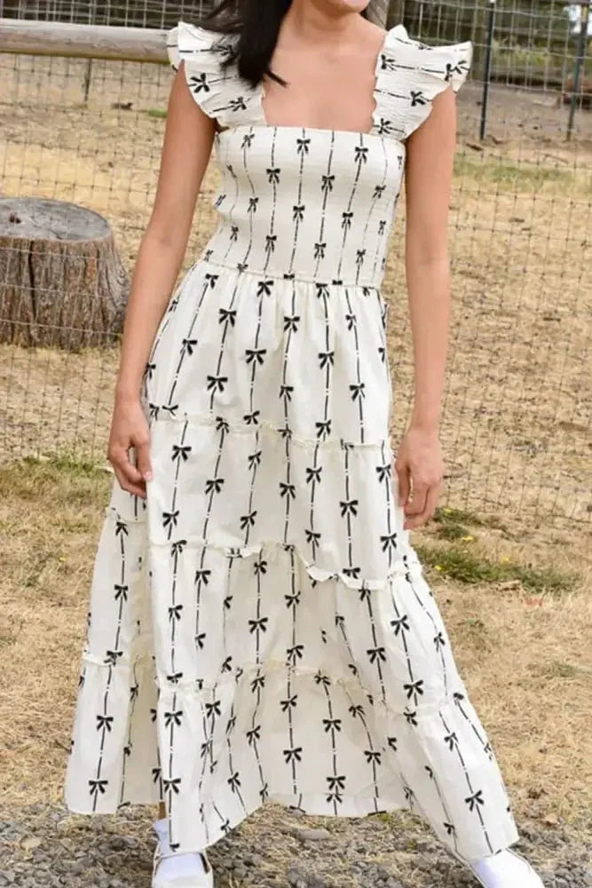 Bow Print Smocked Square Neck Ruffle Tiered Maxi Dress - Update AvenueFestival VibesTrendsi100100002018960100100002018960e70aa865 - 6adb - 4145 - a504 - 826c75caef89 - MaxWhite