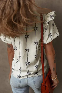 Bow Print Tie Neck Short Sleeve Blouse - Update AvenueVacation StyleTrendsi100100733236571100100733236571c4162f9c - 15b5 - 448b - 8ce4 - 192ad7fb3b4a - MaxIvory