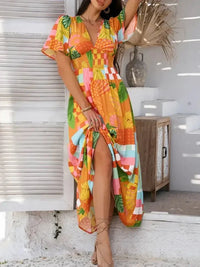 Devine Smocked Printed V - Neck Short Sleeve Maxi Dress - Update AvenueVacation StyleTrendsi1001001292894261001001292894268a6b2e42 - 0542 - 42f2 - a1f2 - 3a9eca2c25cc - MaxTangerine