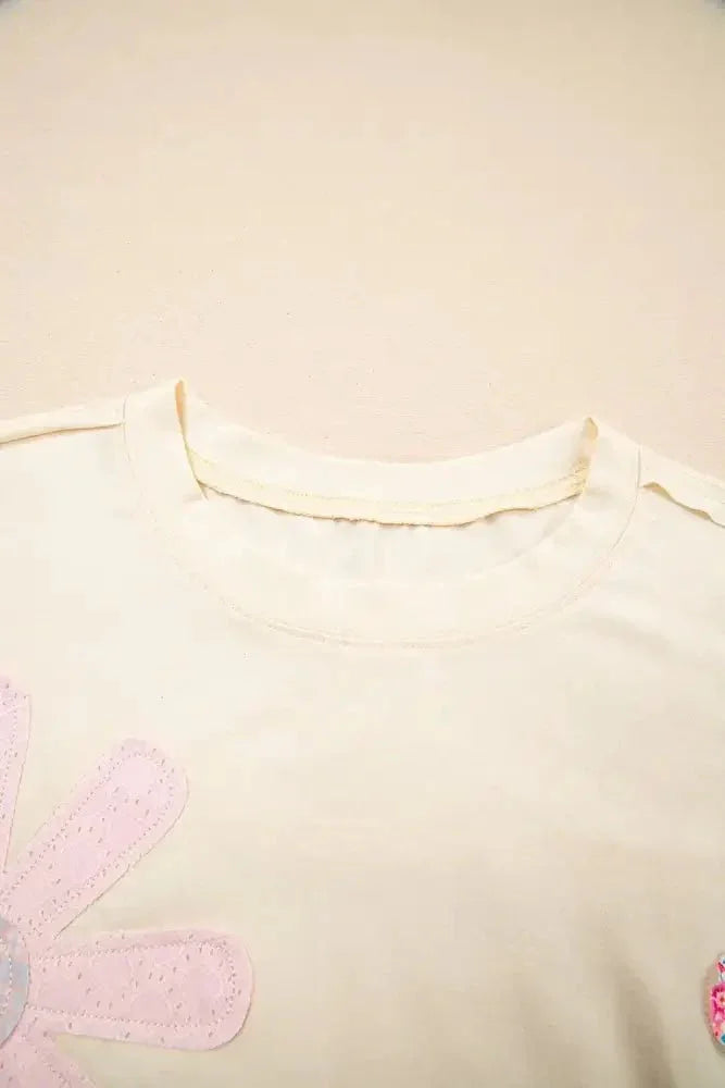 Flower Patched Exposed Stitching Trim Crew Neck Loose Tee - Update AvenueT-ShirtsTrendsi10010025099632310010025099632319aec1af - aea3 - 4cae - bbce - d7ea4270eeef - Max - OriginCream