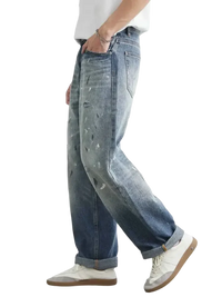 Light blue distressed paint splatter relaxed fit jeans for men with stylish distressed details