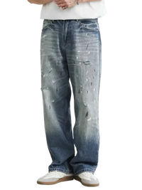 Men’s distressed paint splatter relaxed fit jeans with wide-leg design and faded wash