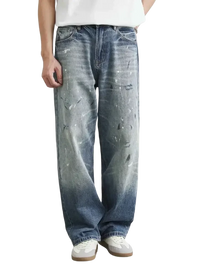 Men’s distressed paint splatter relaxed fit jeans with wide-leg design and faded wash
