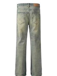 Washed-out blue distressed straight leg jeans with wide legs and leather patch at the back