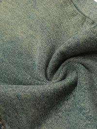 Faded light blue distressed straight leg jeans fabric with twill weave and soft texture