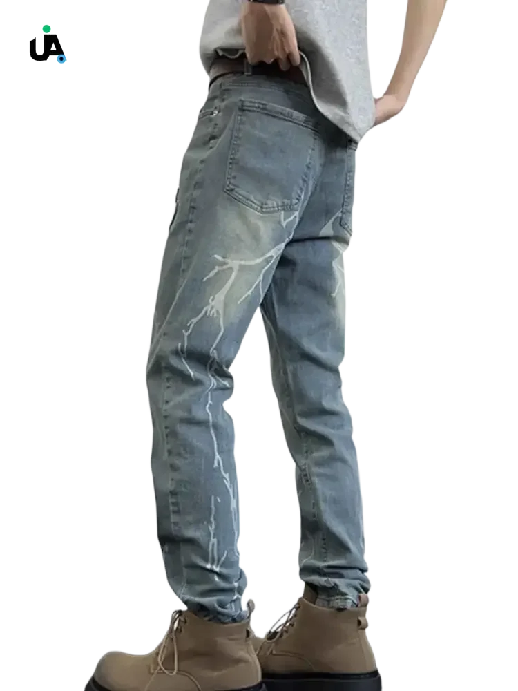 Light blue denim slim fit jeans with white lightning bolt designs for men in plus size