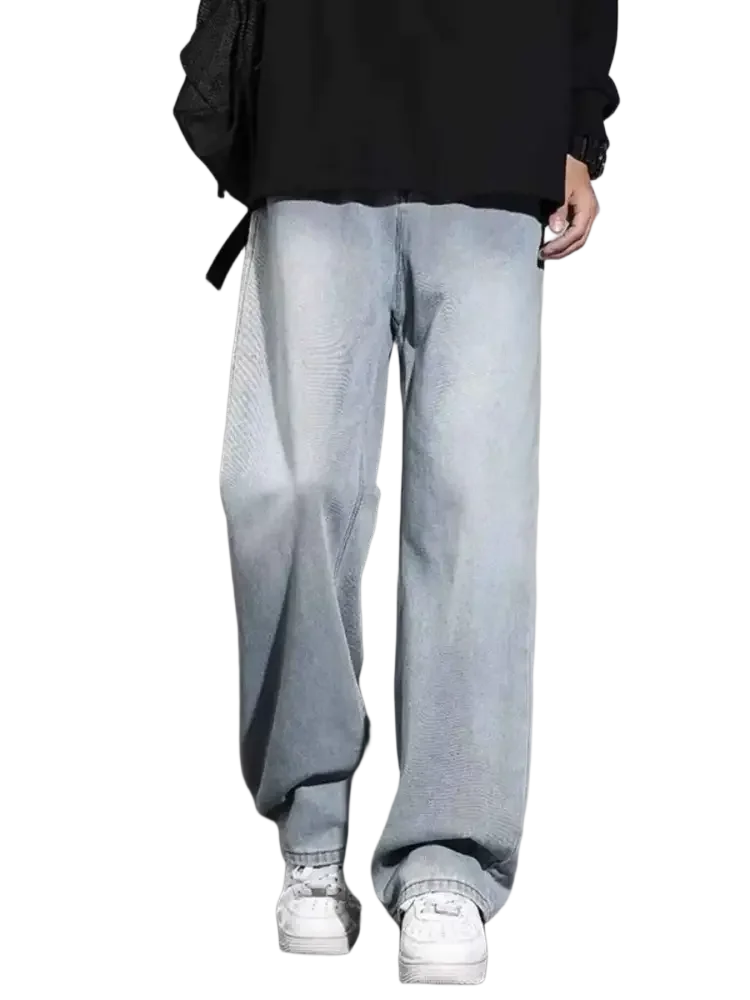 Light wash relaxed fit denim jeans with subtle gradient effect in size wide leg for men