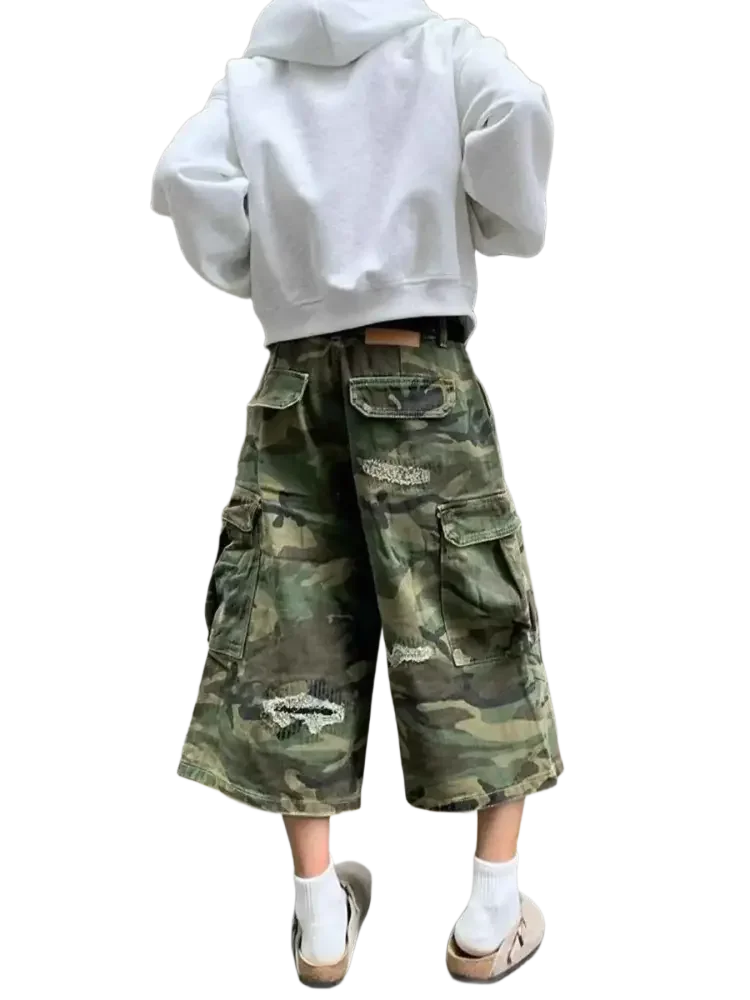 White hooded sweatshirt with distressed camouflage cargo capris in plus size distressed fashion