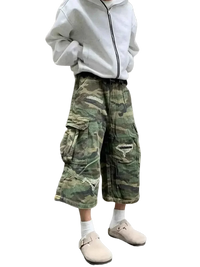 Plus size distressed camouflage cargo capris jeans worn with oversized gray hoodie and beige clogs