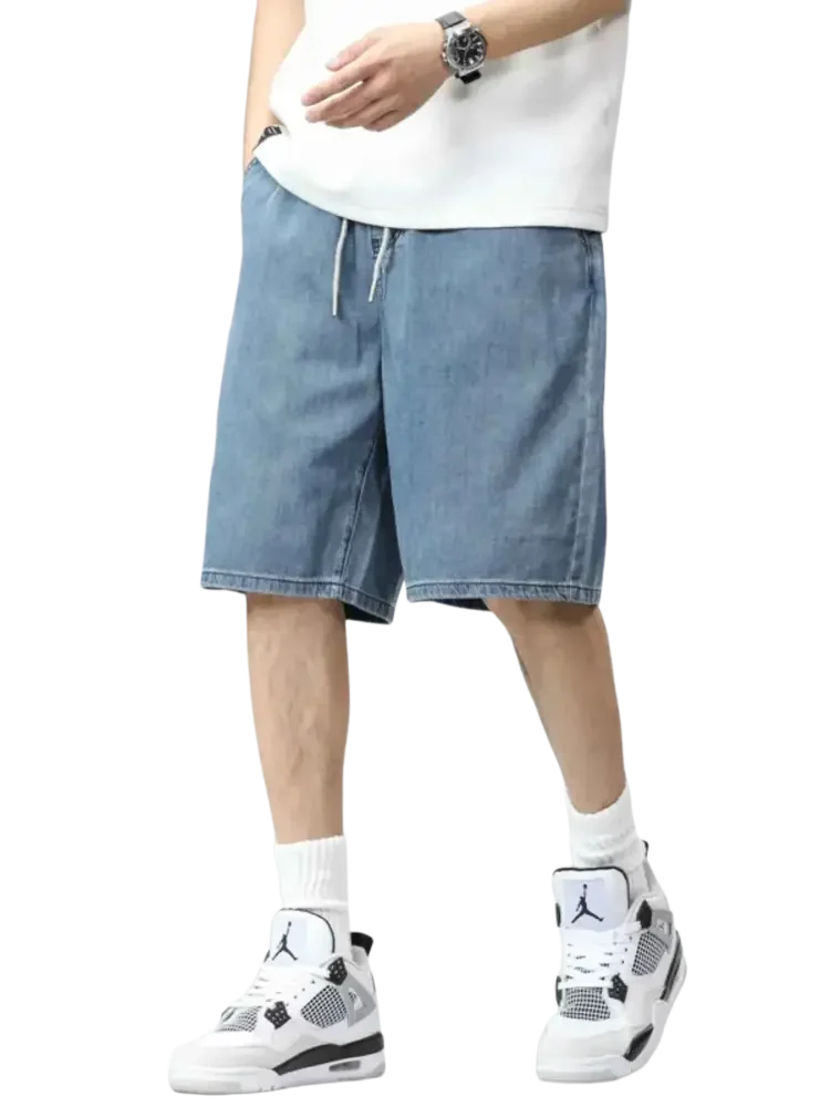 Plus size drawstring denim shorts featuring light wash fabric and adjustable waist