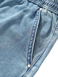 Plus size drawstring denim shorts with elastic waistband and side pockets featuring rivets