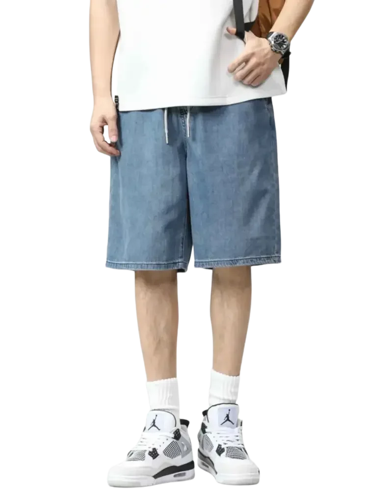 Light blue plus size drawstring denim shorts with a loose fit and adjustable waist