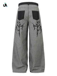 Gray wide leg jeans with black tribal graphics and back pockets for men’s wide leg jeans