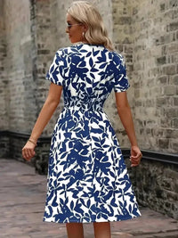 Printed Smocked Surplice Short Sleeve Dress - Update AvenueEffortless Elegance: DressesTrendsi100100408754620100100408754620f82fc465 - 0124 - 462e - 8d18 - 29ca3525fdda - MaxPeacock Blue
