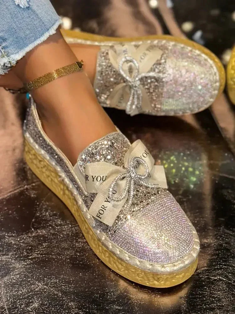 Rhinestone Bow Round Toe Slip - Ons - Update AvenueTrendsi100600541616011100600541616011Rhinestone Bow Round Toe Slip - OnsGold