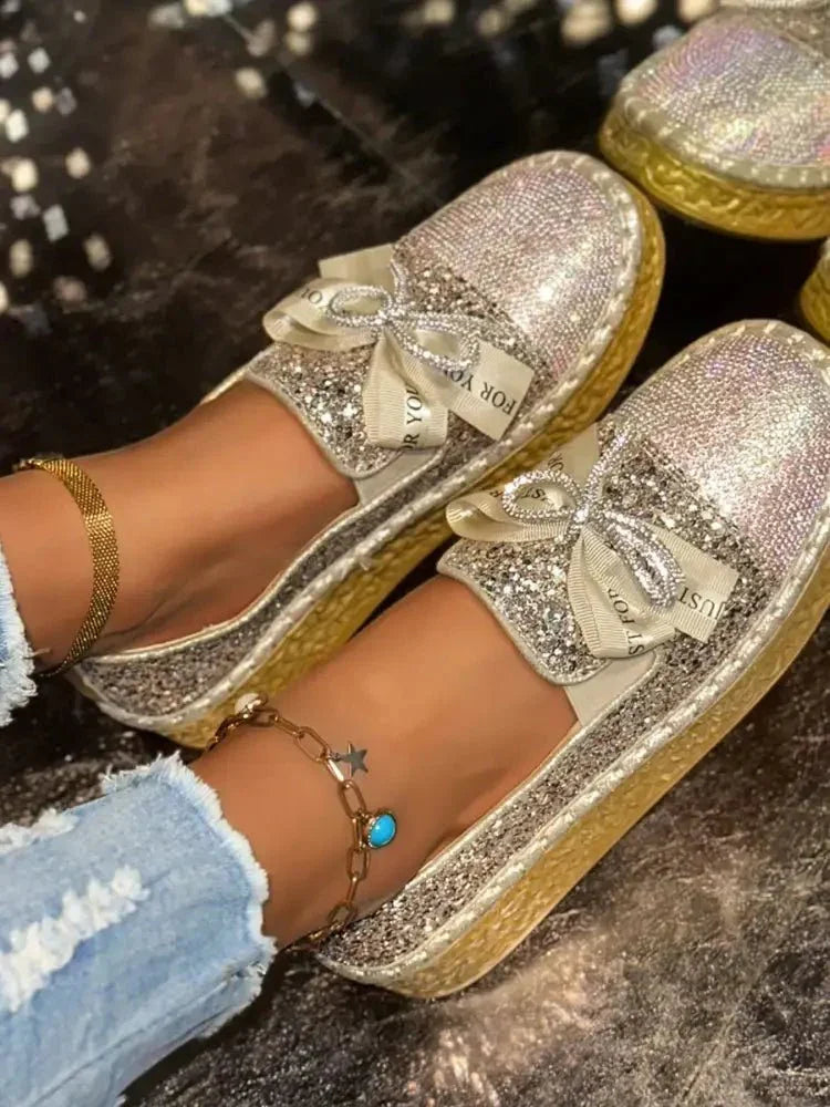Rhinestone Bow Round Toe Slip - Ons - Update AvenueTrendsi100600541616011100600541616011Rhinestone Bow Round Toe Slip - OnsGold