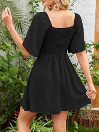 Smocked Back Knotted Flutter Sleeve Dress - Update AvenueEffortless Elegance: DressesTrendsi100100009891318100100009891318d3404620 - 3c29 - 4c0f - afe8 - ef4005c7e105 - Max - OriginBlack