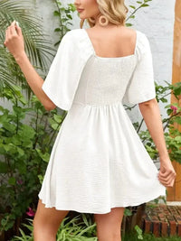 Smocked Back Knotted Flutter Sleeve Dress - Update AvenueEffortless Elegance: DressesTrendsi10010000989196710010000989196796ed11ea - d214 - 4673 - 960c - f78eb943e9f5 - Max - OriginWhite