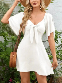 Smocked Back Knotted Flutter Sleeve Dress - Update AvenueEffortless Elegance: DressesTrendsi10010000989196710010000989196751d78842 - 09a0 - 4040 - 8a75 - be012dc50d70 - Max - OriginWhite