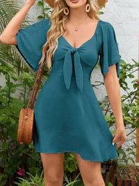 Smocked Back Knotted Flutter Sleeve Dress - Update AvenueEffortless Elegance: DressesTrendsi100100009892158100100009892158eb6498bf - 70b0 - 4c29 - 83dd - 20d94890fa60 - Max - OriginDeep Teal