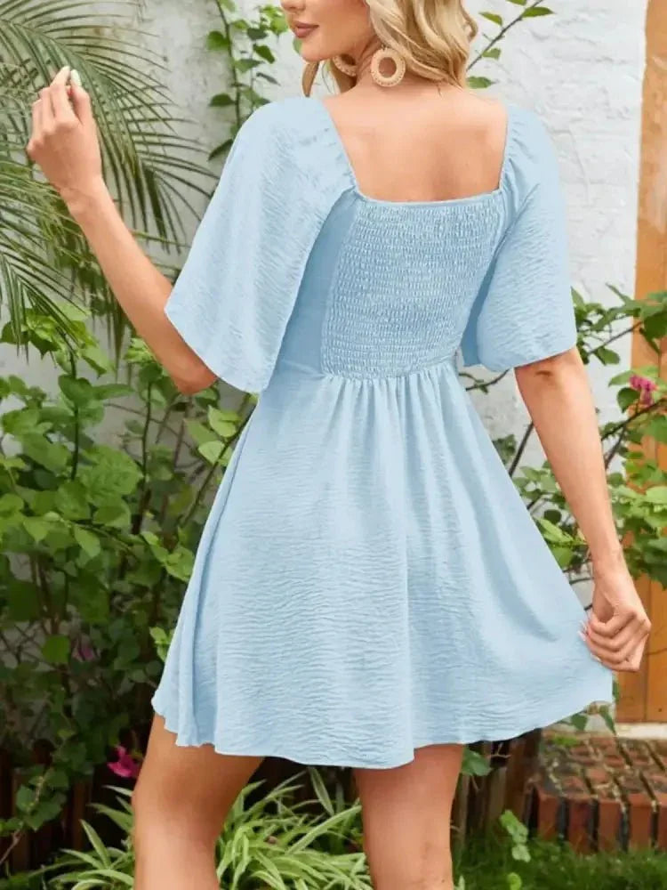 Smocked Back Knotted Flutter Sleeve Dress - Update AvenueEffortless Elegance: DressesTrendsi10010000989259510010000989259506f00749 - de21 - 4b12 - 925e - dbdf56b28c36 - Max - OriginLight Blue