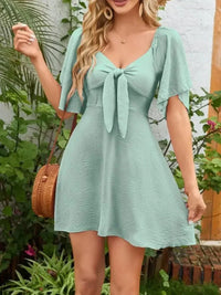 Smocked Back Knotted Flutter Sleeve Dress - Update AvenueEffortless Elegance: DressesTrendsi100100009892968100100009892968c01040ff - b59c - 4ec7 - acd3 - d559e37f6760 - Max - OriginGum Leaf