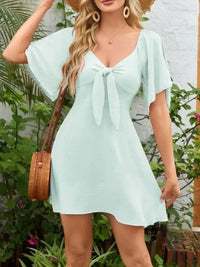 Smocked Back Knotted Flutter Sleeve Dress - Update AvenueEffortless Elegance: DressesTrendsi100100009893306100100009893306a0f4174f - 9df6 - 4549 - b6d7 - 84968a917556 - Max - OriginLight Green