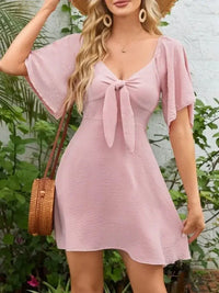 Smocked Back Knotted Flutter Sleeve Dress - Update AvenueEffortless Elegance: DressesTrendsi100100009895376100100009895376045d8620 - b781 - 4687 - 9114 - dbab91daa723 - Max - OriginBlush Pink