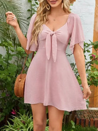 Smocked Back Knotted Flutter Sleeve Dress - Update AvenueEffortless Elegance: DressesTrendsi1001000098953761001000098953767d84a662 - d5c5 - 4f05 - ae1c - 9b36e6a68efb - Max - OriginBlush Pink