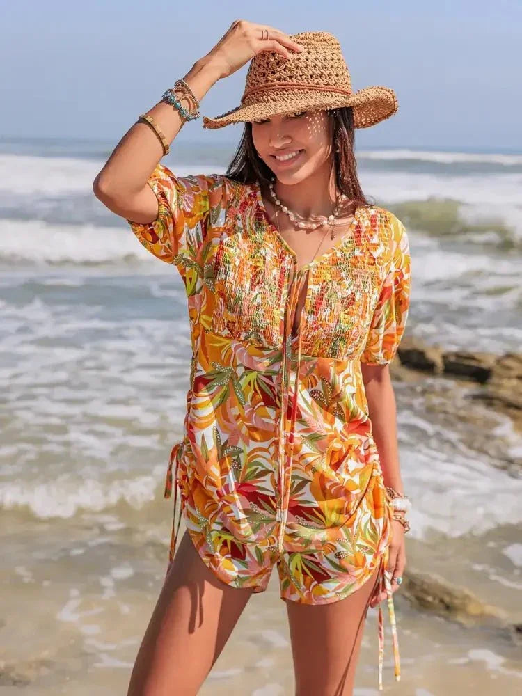 Smocked Printed Tie Neck Romper - Update AvenueBoho VibesTrendsi10010006823180410010006823180495e18a20 - 4bd1 - 4944 - 800e - 444fd9c40e98 - Max - OriginTangerine