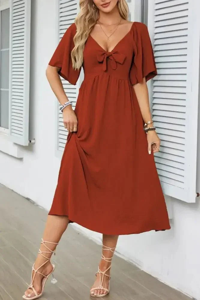 Smocked Tie Front Flutter Sleeve Midi Dress - Update AvenueEffortless Elegance: DressesTrendsi100100290692645100100290692645a0365dba - 9e08 - 47f7 - 92a6 - 4ad51161455b - Max - OriginRust