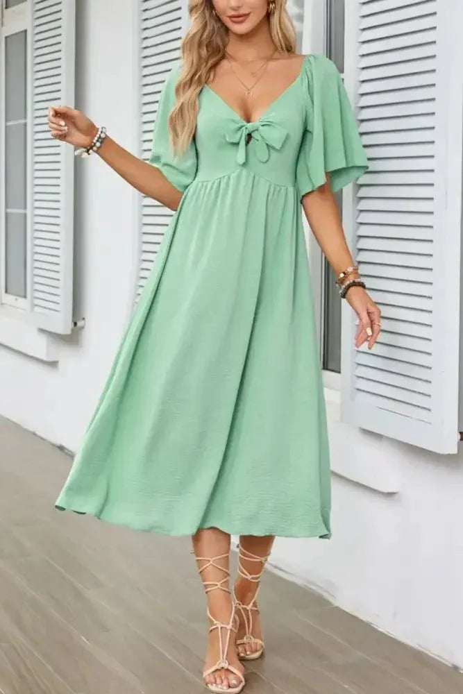 Smocked Tie Front Flutter Sleeve Midi Dress - Update AvenueEffortless Elegance: DressesTrendsi100100290693120100100290693120b092bcc7 - 68a2 - 4c57 - aca2 - 4ebab5468887 - Max - OriginGum Leaf