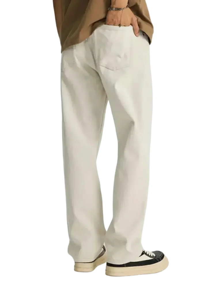 Loose-fitting off-white wide leg jeans paired with black and white platform sneakers