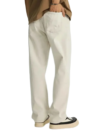 Loose-fitting off-white wide leg jeans paired with black and white platform sneakers