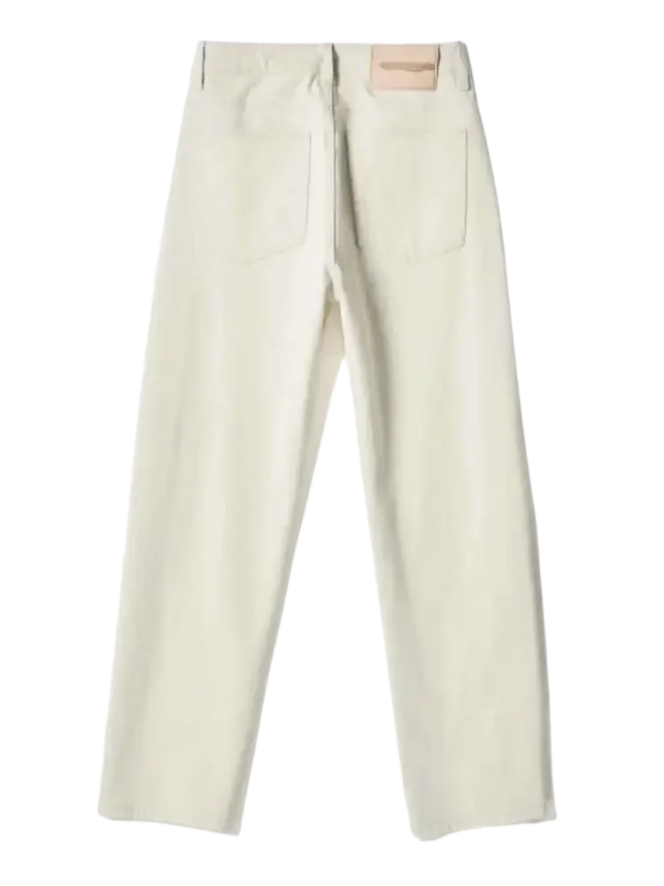 Cream-colored wide leg jeans with back pockets and brand patch for men’s relaxed style