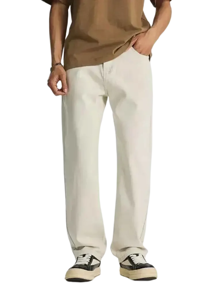 Men’s beige wide leg jeans with black and white sneakers, relaxed fit leg jeans style